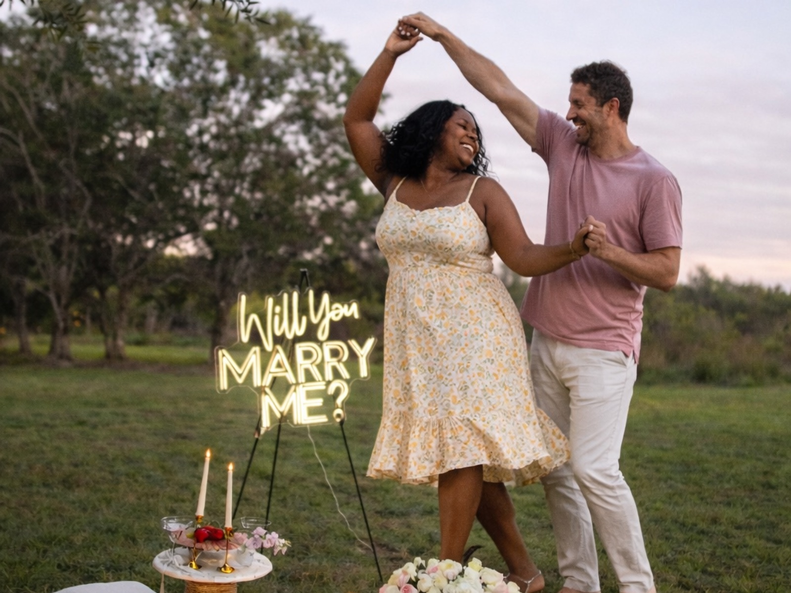 Couple dancing beside a Secret Garden proposal